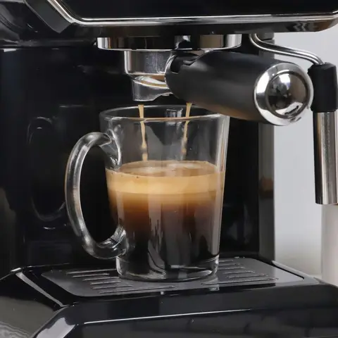 A compact espresso machine on a kitchen counter