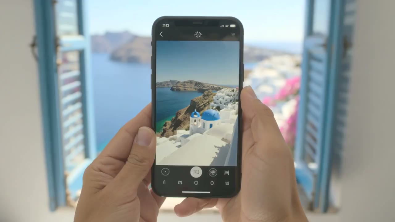 Hands lower a phone showing a photo of Santorini, and the real view through open blue shutters comes into focus: white houses, blue domes and the sea (AI-generated).